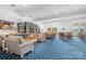 Bright and spacious clubhouse interior with ample seating and a cozy library area for residents at 18236 Coulter Pkwy, Cornelius, NC 28031