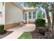 Charming patio view, with comfortable seating and a landscaped yard in a well-maintained neighborhood at 18236 Coulter Pkwy, Cornelius, NC 28031