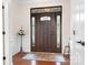 A stunning entryway with hardwood floors, a stylish front door, and beautiful decorative accents at 18236 Coulter Pkwy, Cornelius, NC 28031
