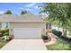 Charming home featuring an attached garage, landscaping, and sidewalk with beautiful trees at 18236 Coulter Pkwy, Cornelius, NC 28031