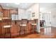 Kitchen with stainless steel appliances, granite countertops, and bar stool seating at 18236 Coulter Pkwy, Cornelius, NC 28031