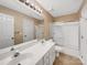 This bathroom features a double sink vanity and shower with sliding glass doors at 2027 Brook View Ct, Matthews, NC 28104