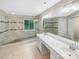 This bathroom features a large shower, tile floors, and a double sink vanity at 2027 Brook View Ct, Matthews, NC 28104