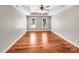 This large bedroom features gorgeous hardwood floors, neutral walls, and a tray ceiling at 2027 Brook View Ct, Matthews, NC 28104