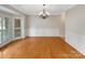 Dining area featuring hardwood floors, chandelier, panel molding, and bright windows at 2027 Brook View Ct, Matthews, NC 28104