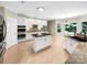 Spacious kitchen with white cabinets, stainless steel appliances, and a center island at 2027 Brook View Ct, Matthews, NC 28104