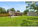 Spacious backyard with a patio, grilling area, and fenced perimeter offers ample space for outdoor activities and relaxation at 2476 Cane Mill Rd, Lancaster, SC 29720