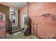A basement utility area with water heater and storage shelving, conveniently located near the interior stairs at 2476 Cane Mill Rd, Lancaster, SC 29720