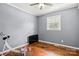 Bedroom with hardwood floors, blue walls, and a window for natural light at 2476 Cane Mill Rd, Lancaster, SC 29720