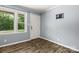 Clean entryway with a window view, a white door, and wood-look flooring; minimalist and bright at 2476 Cane Mill Rd, Lancaster, SC 29720