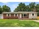 Charming brick home with a well-maintained front yard, neutral shutters, and a classic chimney at 2476 Cane Mill Rd, Lancaster, SC 29720