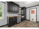 Modern kitchen with black cabinets, butcher block countertops, and stainless steel appliances at 2476 Cane Mill Rd, Lancaster, SC 29720