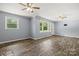 Large living room with durable wood-look flooring, neutral walls, a fireplace, and ceiling fans at 2476 Cane Mill Rd, Lancaster, SC 29720