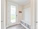 Entryway with a white door, storage bench, and key rack, offering a practical and welcoming space with natural light at 257 Auburn View Rd, Rock Hill, SC 29730