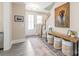 Inviting foyer with stylish decor, featuring a console table and staircase at 257 Auburn View Rd, Rock Hill, SC 29730
