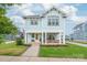 Inviting two-story home featuring a charming front porch with stylish decor and curb appeal at 257 Auburn View Rd, Rock Hill, SC 29730