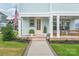 Inviting front porch with a glass door, comfortable seating, and manicured landscaping creating an appealing entrance at 257 Auburn View Rd, Rock Hill, SC 29730