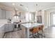 Bright kitchen with stainless steel appliances, white countertops and gray cabinetry, featuring a central island with seating at 257 Auburn View Rd, Rock Hill, SC 29730