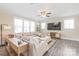 Bright living room with a neutral color palette, a sectional sofa, a television, and natural light from large windows at 257 Auburn View Rd, Rock Hill, SC 29730