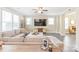 Cozy living room featuring a large sectional sofa, a ceiling fan, a TV, and an entertainment center at 257 Auburn View Rd, Rock Hill, SC 29730