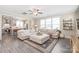 Spacious living room featuring modern decor, a comfortable sofa, a large window, and an open concept to the kitchen at 257 Auburn View Rd, Rock Hill, SC 29730