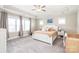 Spacious main bedroom with tray ceilings, three windows, and a ceiling fan with lots of natural light at 257 Auburn View Rd, Rock Hill, SC 29730