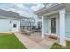 Cozy backyard patio with outdoor seating, a dining area, and well-maintained lawn offering a relaxing outdoor space at 257 Auburn View Rd, Rock Hill, SC 29730