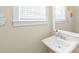 Powder room features a sink with a mirror, decorative wall art, and a clean, minimalist design at 257 Auburn View Rd, Rock Hill, SC 29730