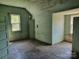 Empty bedroom features wood slat paneled walls, hardwood floors and a window for natural light at 275 Hiddenite Church Rd, Hiddenite, NC 28636