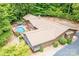 An aerial shot of the home highlighting the backyard pool, screened porch and surrounding lush greenery at 2915 Old Stage Rd, Gastonia, NC 28052