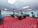 Spacious basement with game tables, workout area, and classic red plaid carpet at 2915 Old Stage Rd, Gastonia, NC 28052