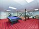 Large basement featuring a pool table and a games table on a red plaid carpet at 2915 Old Stage Rd, Gastonia, NC 28052