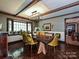 Bright dining room with wood floors, coffered ceilings, and large bay window overlooking the front yard at 2915 Old Stage Rd, Gastonia, NC 28052
