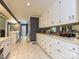 Bright dressing room with white cabinets, drawers, countertop and mirror with gray walls and tiled floors at 2915 Old Stage Rd, Gastonia, NC 28052