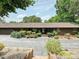Ranch-style home featuring a charming facade, mature landscaping, and a spacious driveway at 2915 Old Stage Rd, Gastonia, NC 28052