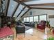 The living room features a vaulted ceiling with exposed beams and abundant natural light at 2915 Old Stage Rd, Gastonia, NC 28052