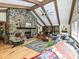 The living room features a vaulted ceiling, exposed beams, stone fireplace, and hardwood floors at 2915 Old Stage Rd, Gastonia, NC 28052