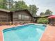 Backyard pool with blue water and lounge chairs offers a great space for recreation at 2915 Old Stage Rd, Gastonia, NC 28052