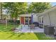 Well-maintained backyard with a patio, seating area, and outdoor cooking space at 3035 Florida Ave, Charlotte, NC 28205