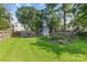 Spacious backyard featuring a garden area, wooden fence, and storage shed at 3035 Florida Ave, Charlotte, NC 28205