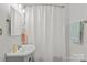 Bright bathroom featuring tiled shower with tub and vanity at 3035 Florida Ave, Charlotte, NC 28205