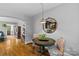 Dining table with hardwood floors, stylish chairs, and view to the hallway and desk at 3035 Florida Ave, Charlotte, NC 28205