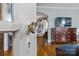 Close up of vintage glass door knob with hardwood floors and living space in the background at 3035 Florida Ave, Charlotte, NC 28205