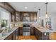 Well-equipped kitchen boasts stainless appliances, ample counter space, and dark wood cabinetry at 3035 Florida Ave, Charlotte, NC 28205