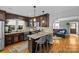 Well-equipped kitchen with stainless steel appliances, hardwood floors, and eat in island at 3035 Florida Ave, Charlotte, NC 28205