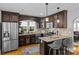 Well-equipped kitchen with stainless steel appliances, granite countertops, and hardwood floors at 3035 Florida Ave, Charlotte, NC 28205