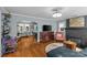 Spacious living room with hardwood floors, fireplace, and view to kitchen area at 3035 Florida Ave, Charlotte, NC 28205