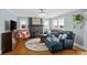 Comfortable living room featuring a fireplace, plush seating, and hardwood floors at 3035 Florida Ave, Charlotte, NC 28205