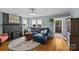 Cozy living room with fireplace, hardwood floors, and comfortable seating arrangement at 3035 Florida Ave, Charlotte, NC 28205