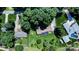 Bird's eye view of a home with lush greenery, mature trees, swimming pool, and peaceful surroundings at 3135 Lake Shore S Rd, Denver, NC 28037